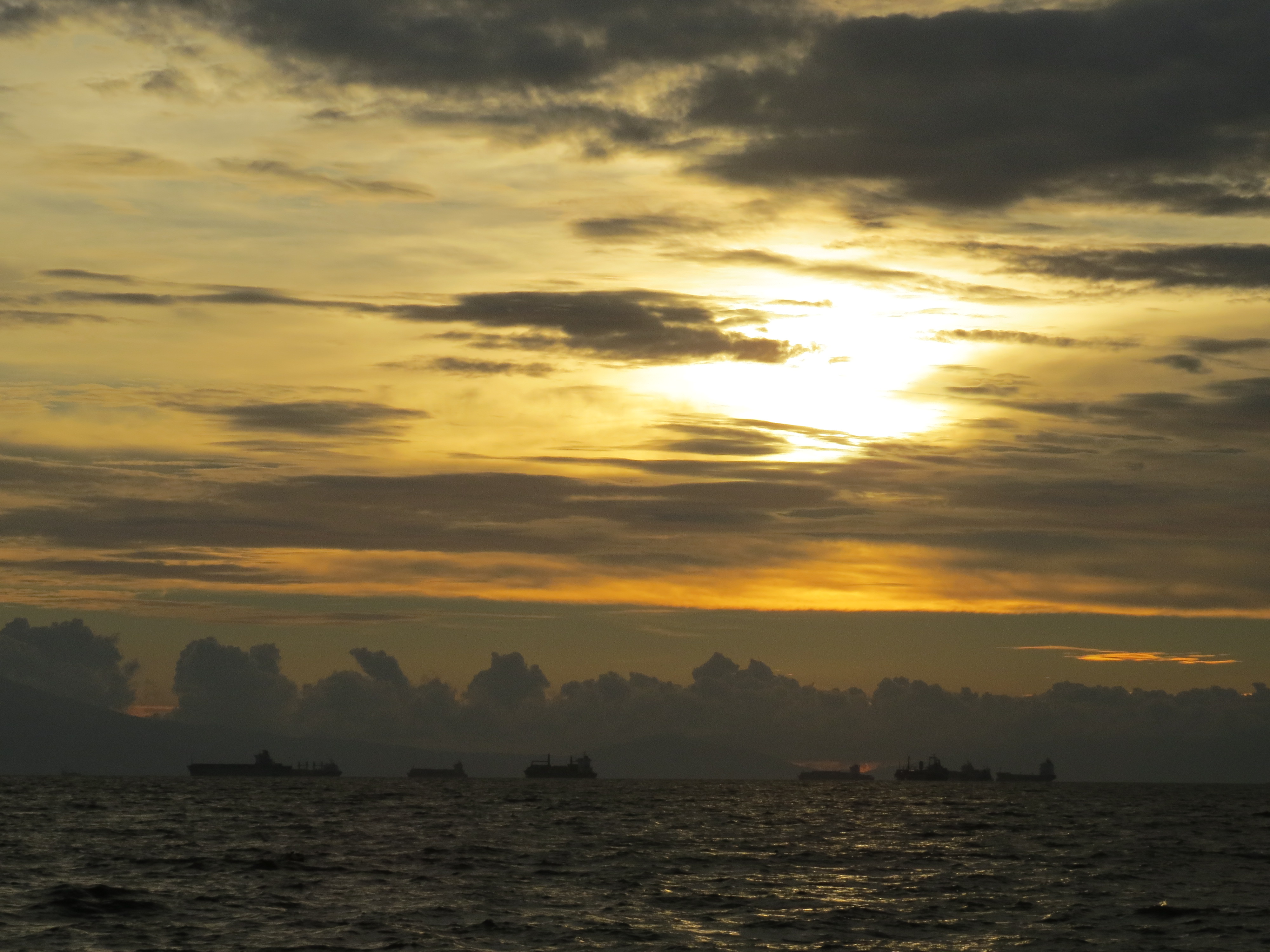 Ships on the horizon waiting in Manila Bay